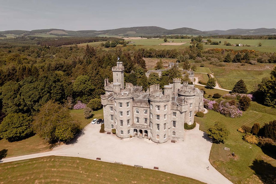 view of cluny castle from drone with surrounding land